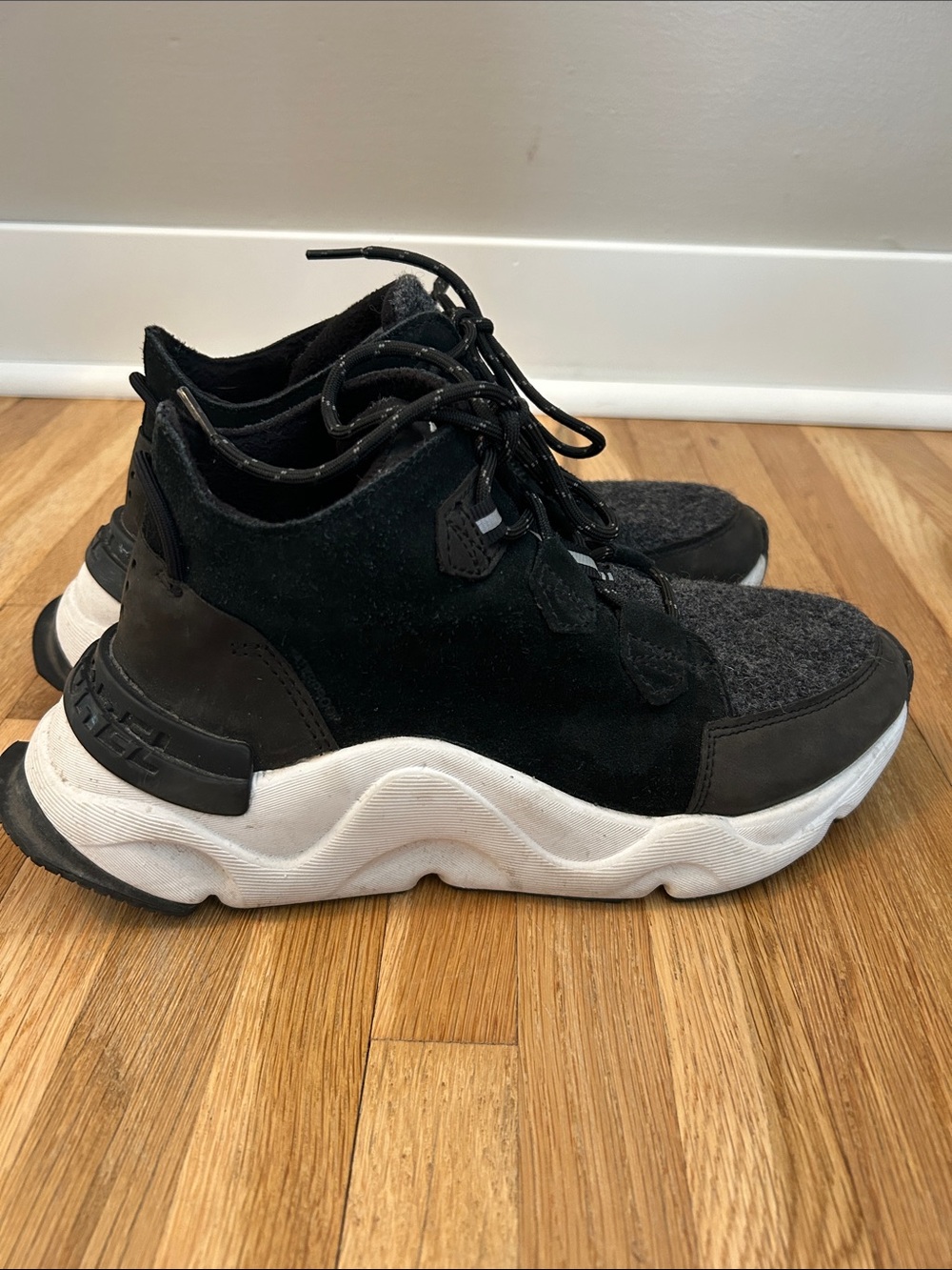 Sorel. Women’s Black Chunky Sneaker with White Sole.